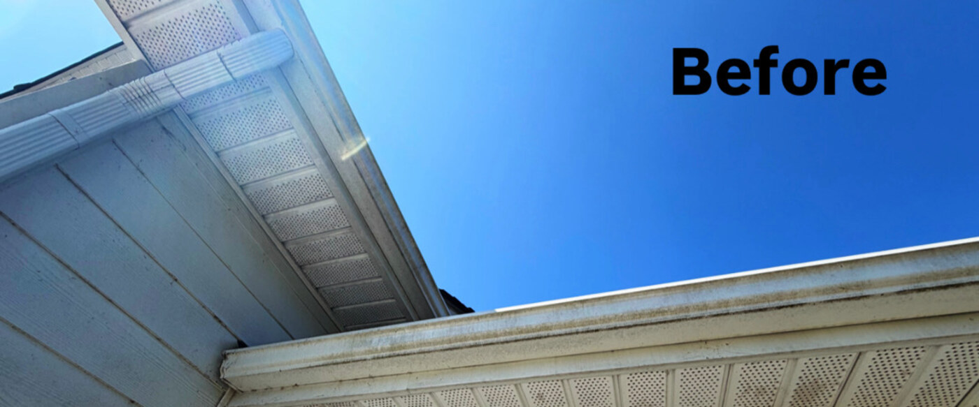 Stained gutter face before and after cleaning — before