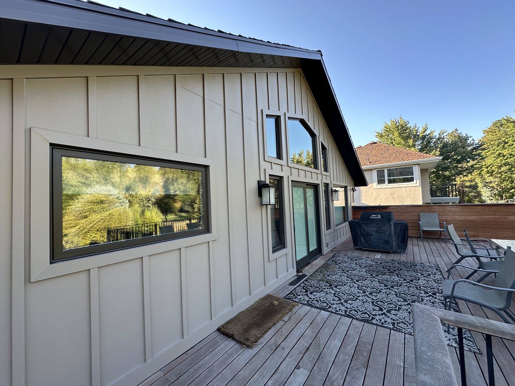 Board and batten home exterior with clean windows and deck